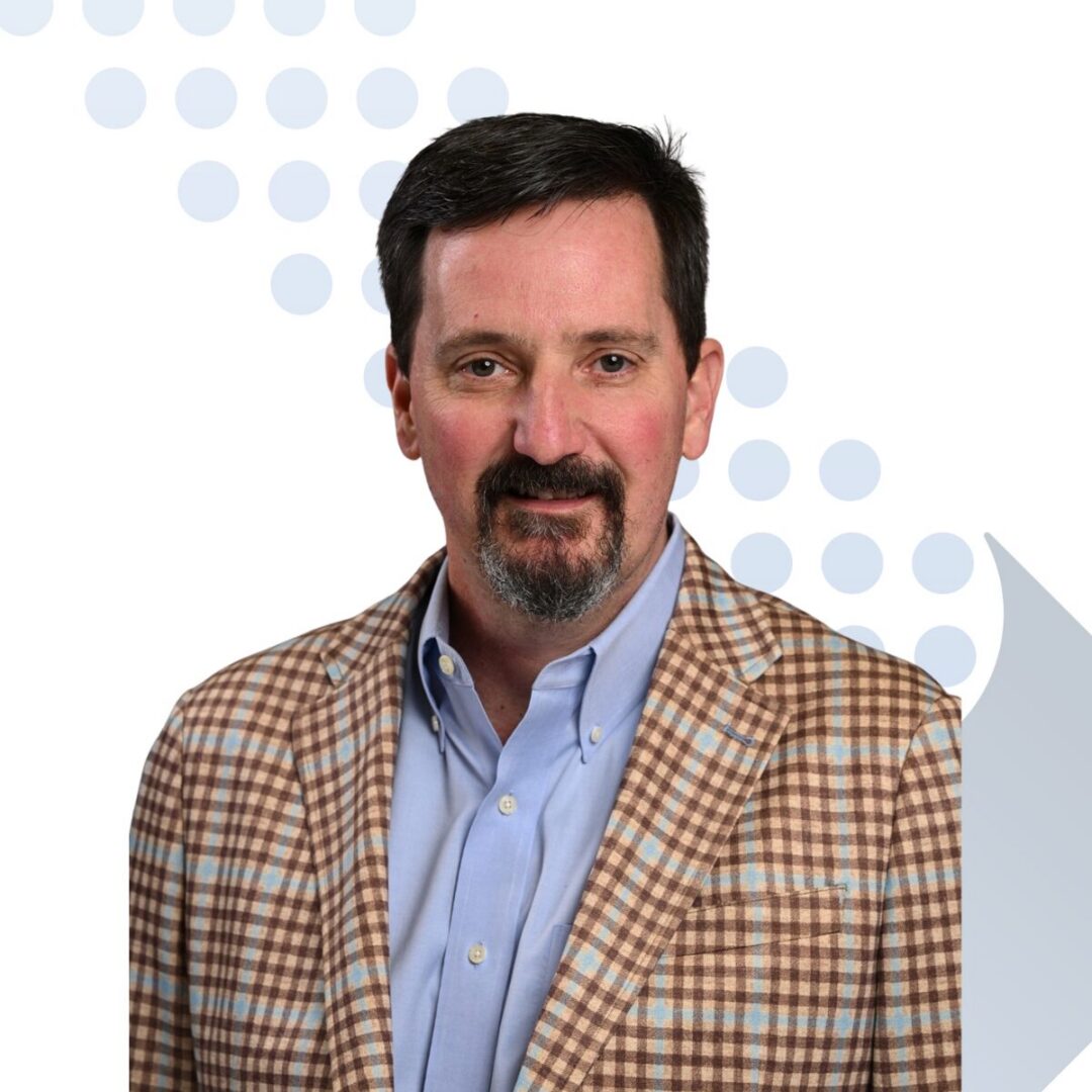 <b>Tim Netherton</b> Man in checked blazer over light blue shirt