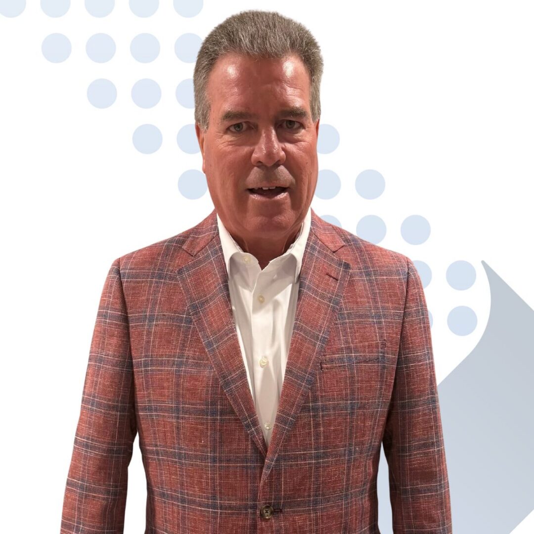 <b>Larry Jacob</b> Man wearing red plaid blazer and white shirt